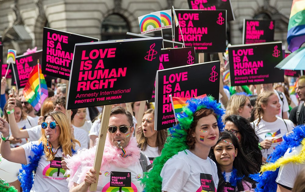 love is a human right signs parade