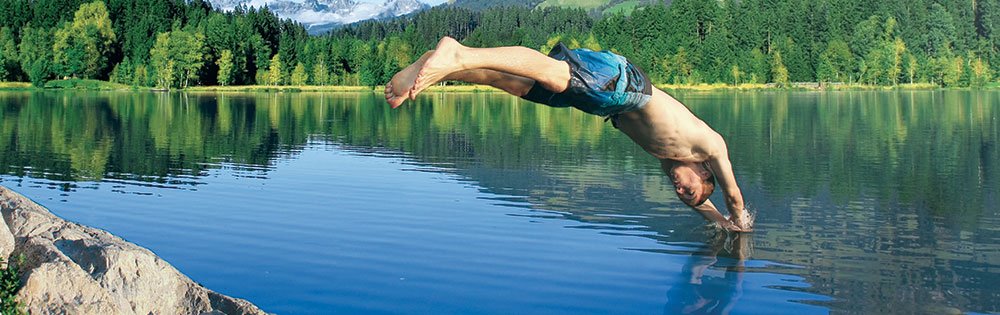 guy diving into a lake