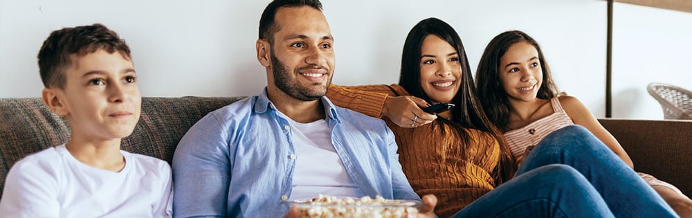 family watching movie popcorn