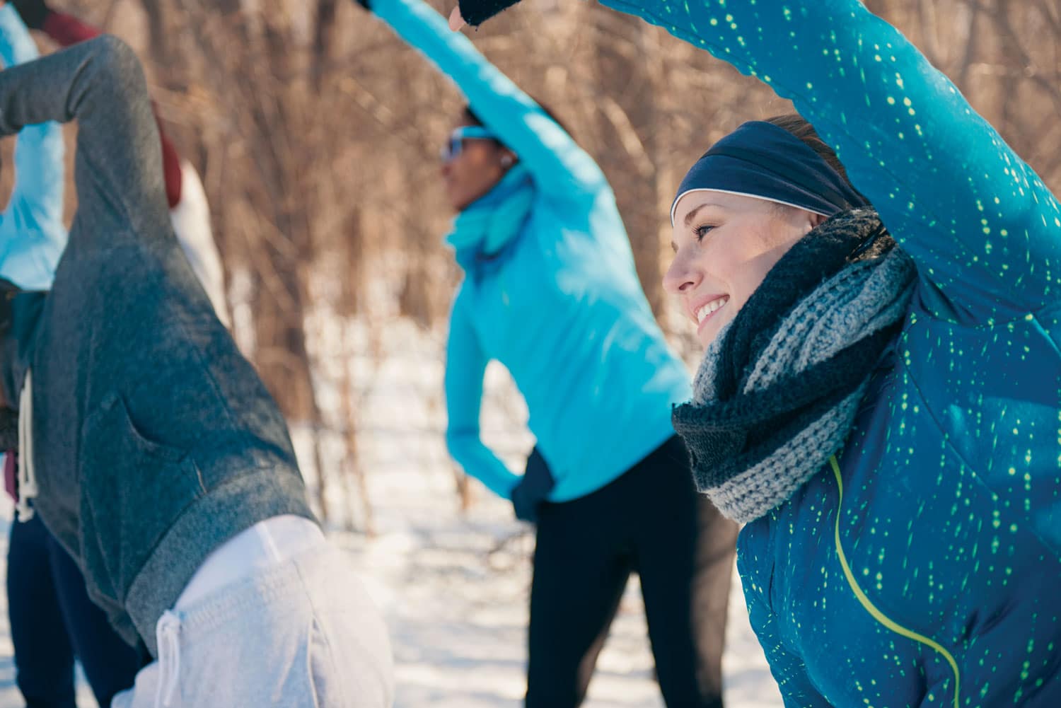 group side stretch outside winter wearing blue