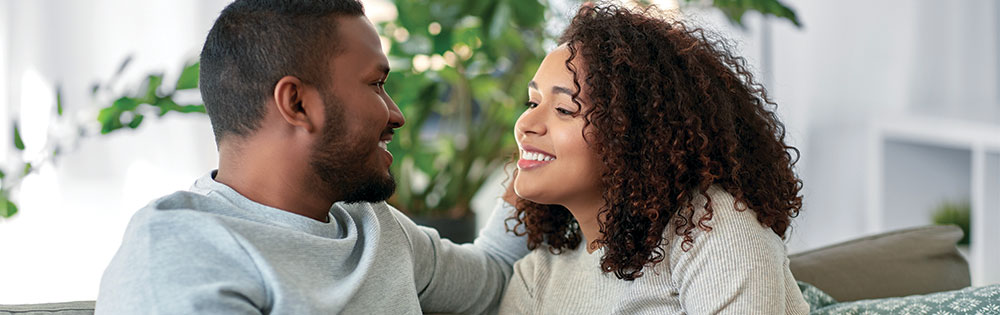 couple talking on couch