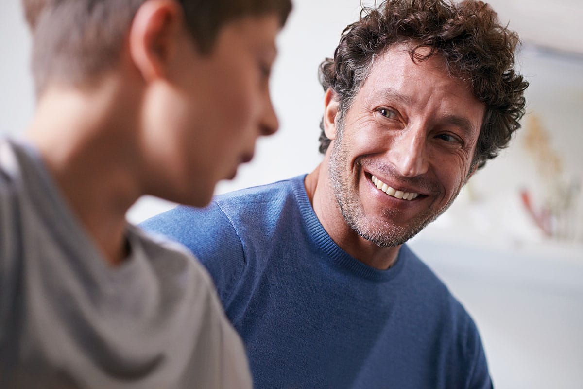 dad talking to teen son